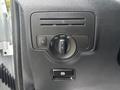 Close-up of the control panel in a 2021 Mercedes-Benz Metris featuring knobs for lights and various settings