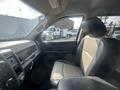 Interior view of a 2012 RAM 2500 with a focus on the driver's seat and dashboard features