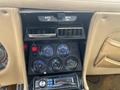 The interior dashboard of a 1970 Chevrolet Corvette featuring gauges for fuel temperature oil pressure and battery alongside a modern stereo system