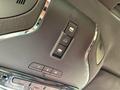 Close-up of a control panel featuring buttons for windows and other functions in a 2016 Maserati Ghibli's interior