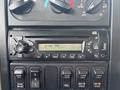 Dashboard panel of a 2013 International WorkStar featuring an audio system display with buttons for various functions and controls