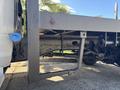 A 2014 RAM 5500 chassis showing the undercarriage with a reinforced frame and suspension components