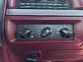 Control panel of a 1995 Ford F-250 featuring knobs for temperature and air circulation settings