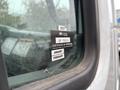 A 2013 Freightliner 114SD truck with a visible certification sticker on the window indicating approval and the months of January and February