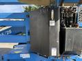 A 2012 Genie Z 45/25 aerial work platform showcasing a control panel and hydraulic components in blue and black colors