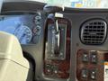 The image shows the interior dashboard of a 2012 Freightliner M2 106 with gauges a gear shifter and control buttons