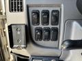 Control panel with six buttons for vehicle functions including lights and hazards on a 2015 Peterbilt 337
