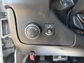 Close-up of the control panel in a 2020 Chevrolet Express showing the headlight control and dome light switch