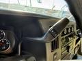 Close-up of the gear shift lever of a 2017 Chevrolet Express showing the control for adjusting gears