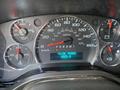 Dashboard of a 2023 GMC Savana showing speedometer fuel gauge and engine hours display with readings and indicators