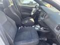 Interior of a 2017 Dodge Charger showing front seats and dashboard with controls and gear shift visible