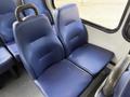 Two blue upholstered seats from a 2020 Chevrolet Express van with a textured surface and armrests on either side