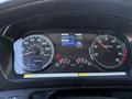 Dashboard display of a 2015 Hino 358 showing speedometer fuel gauge and various indicators in a vehicle cockpit