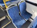 Two blue bus seats with star-like patterns inside a 2016 Grande West Vicinity bus