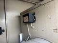 A black Katolight SED60FPJ4 control module mounted on a metal panel with wires connected to it