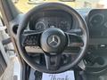 Interior view of a 2019 Mercedes-Benz Sprinter showcasing the steering wheel and dashboard with various controls and dials