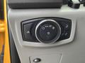 A control panel featuring knobs and buttons for headlights and interior lighting in a 2017 Ford F-250 SD