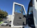 A 2013 International 7500 truck's open door showcasing the interior panel and handle