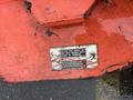 A red 2010 Kubota F3680 lawn mower with a caution label that warns against putting hands or feet near the mower when the engine is running