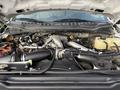 The engine compartment of a 2020 Ford F-550 showing various engine components and piping