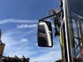 A close-up view of a side mirror on a 2018 Sandvik Ranger DX800 drilling rig with various mechanical components visible