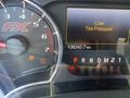 Dashboard display of a 2014 Ford F-150 showing low tire pressure warning and an odometer reading of 108242.7 km