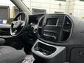 Interior view of a 2020 Mercedes-Benz Metris showcasing the dashboard steering wheel and center console with controls and a display screen