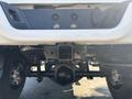 A 2018 RAM 3500 truck's rear view showing the hitch and axle underneath the vehicle