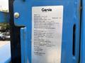 A 2016 Genie TZ-34/20 aerial work platform with model specifications and safety information displayed on a metal plate attached to the machine