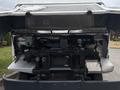 A 2018 Ford Econoline with its hood lifted showing the engine compartment and various components including hoses and fluids