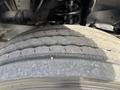 Close-up of a worn tire on a 2013 RAM 5500 showing visible tread wear and cracks on the surface