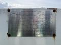 A metal identification plate attached to a 1996 Kenworth T800 truck featuring details like manufacturer, model, tank specifications, and assembly date