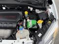 Engine compartment of a 2017 RAM ProMaster City showing the motor and various components including the battery and fluid reservoirs