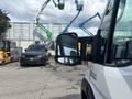 A 2023 RAM Promaster 3500 van is parked with its side mirror visible in the foreground