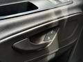 Interior door handle of a 2022 Mercedes-Benz Sprinter with controls for locking and unlocking the door