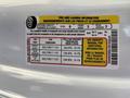 A 2019 Ford F-150 tire information label detailing tire sizes and pressures for the front and rear tires along with seating capacity and loading information