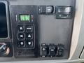 Control panel of a 2015 Peterbilt 337 featuring buttons for transmission settings and functions including select, monitor, start, stop, and PTO control