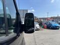 2025 Ford Transit T-350 side mirror showing a sleek design with a black casing and glass reflecting the surroundings