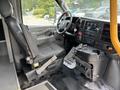 Interior view of a 2020 Chevrolet Express showing the driver's seat steering wheel and dashboard controls