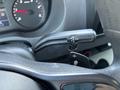 Close-up of the gear shift lever for a 2019 Mercedes-Benz Sprinter featuring R N D positions and additional controls for shifting, set within the vehicle's interior