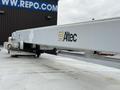 A white Altec aerial work platform mounted on the roof of a 2006 Freightliner FS65 truck
