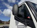 Close-up of the side mirror and window of a 2022 Lion Lion6 electric truck