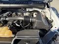 A 2018 Ford F-150 engine compartment displaying the air intake and surrounding engine components