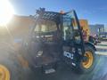 A 2013 JCB 510-56 Loadall with a yellow and black exterior featuring large wheels a cab for the operator and a telescopic lifting arm at the front