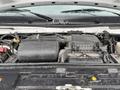 The engine compartment of a 2024 Ford E-450 showing various engine components including the air intake and black plastic covers
