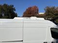 A white 2021 Mercedes-Benz Sprinter 2500 with a Thermo King rooftop unit, showcasing its side profile and sleek design