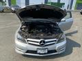 2013 Mercedes-Benz C-Class with the hood open revealing the engine compartment