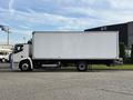 A 2022 Lion Lion6 electric truck with a white box cargo area parked on a street
