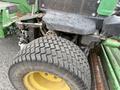 A 2009 John Deere 2653B Precision Diesel Mower featuring a large rear tire and seat with a textured black surface