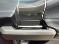 Close-up of the door handle of a 2019 Ford F-150 featuring a metallic finish and textured black material